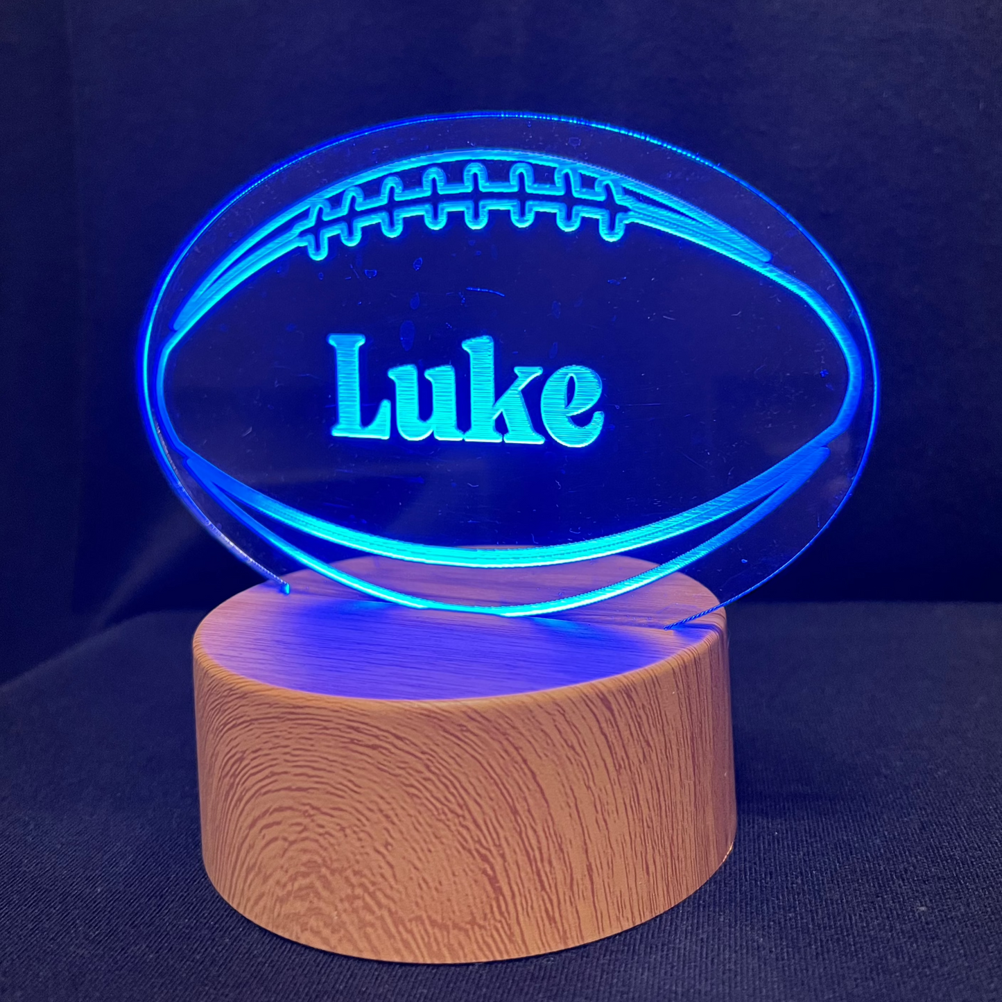 Football Name Night Light – Personalized LED night light featuring an engraved football design with a custom name in the center, glowing warmly for football players and fans.