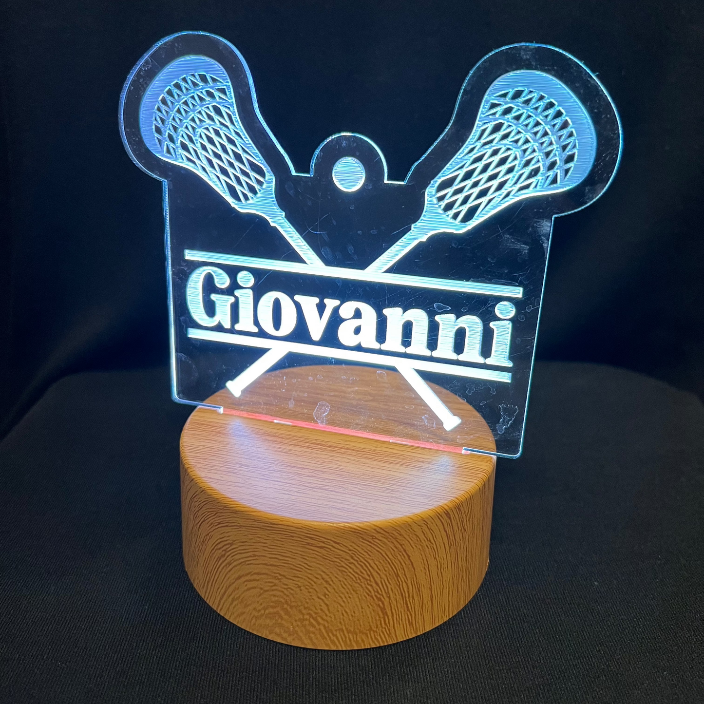 Lacrosse Name Night Light – Personalized LED night light featuring an engraved lacrosse stick and ball design with a custom name in the center, softly glowing for lacrosse players and fans.