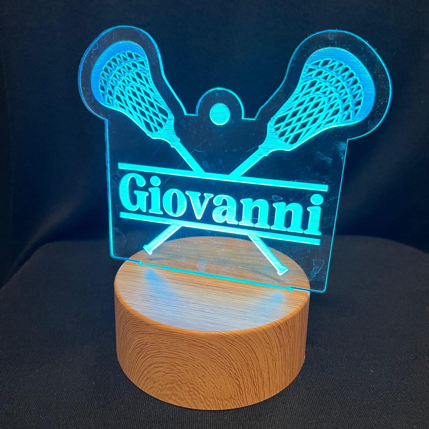 Lacrosse Name Night Light – Personalized LED night light featuring an engraved lacrosse stick and ball design with a custom name in the center, softly glowing for lacrosse players and fans.