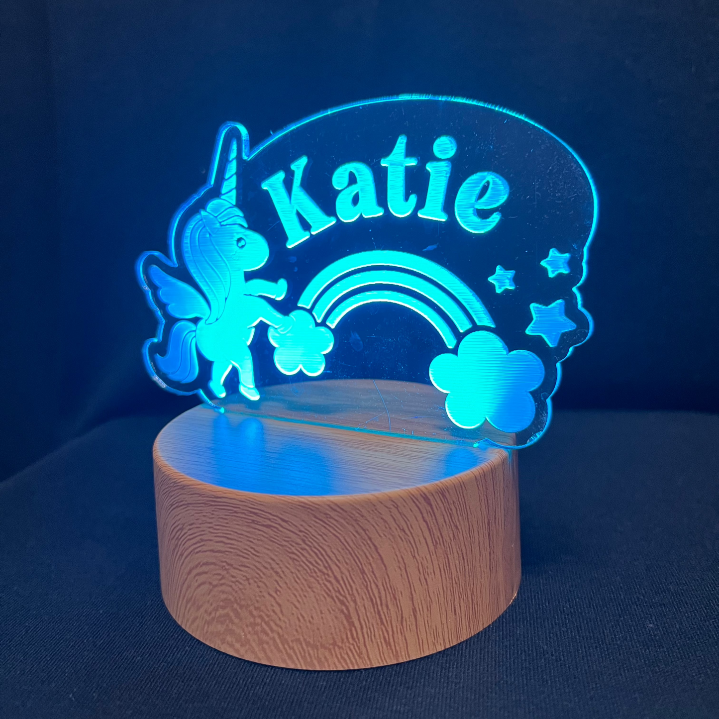 Unicorn Name Night Light – Personalized LED night light featuring an engraved unicorn with a rainbow and stars, glowing softly around a custom name for a magical, dreamy touch