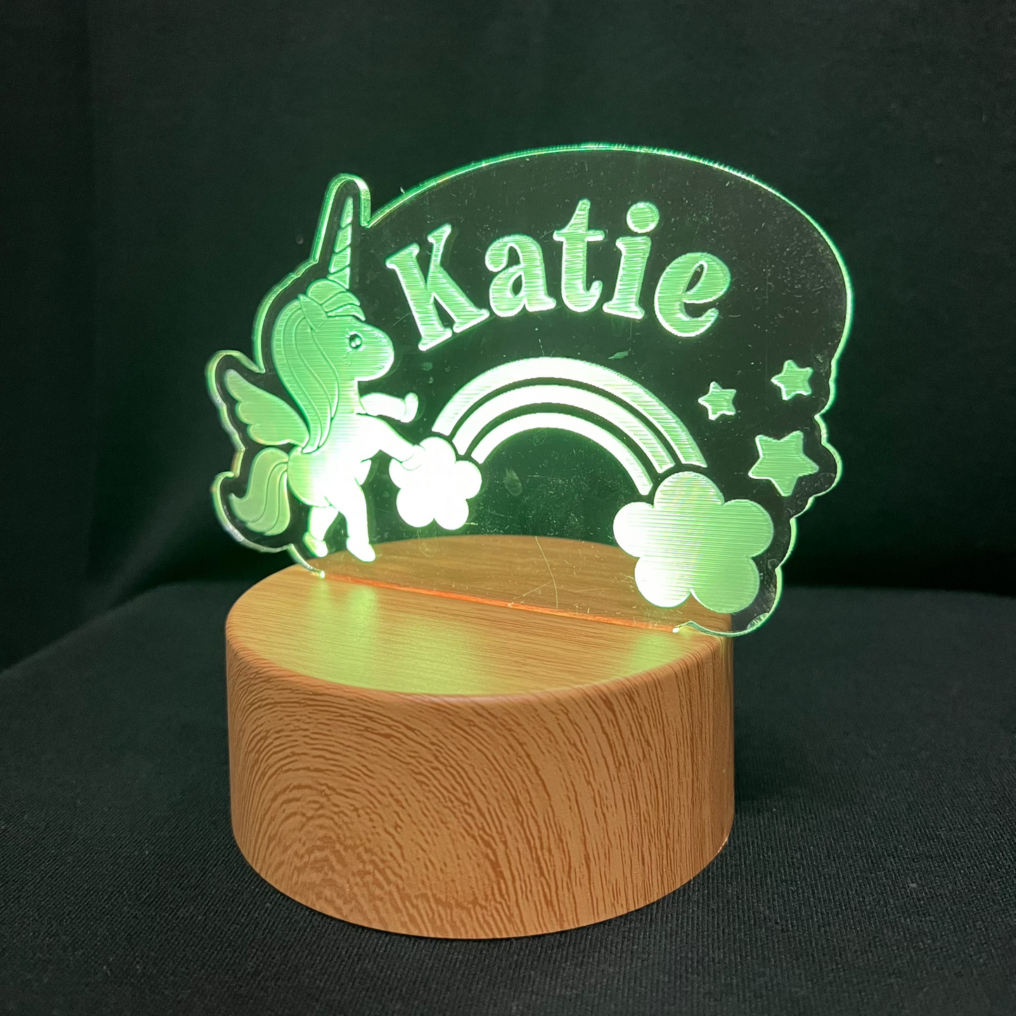 Unicorn Name Night Light – Personalized LED night light featuring an engraved unicorn with a rainbow and stars, glowing softly around a custom name for a magical, dreamy touch