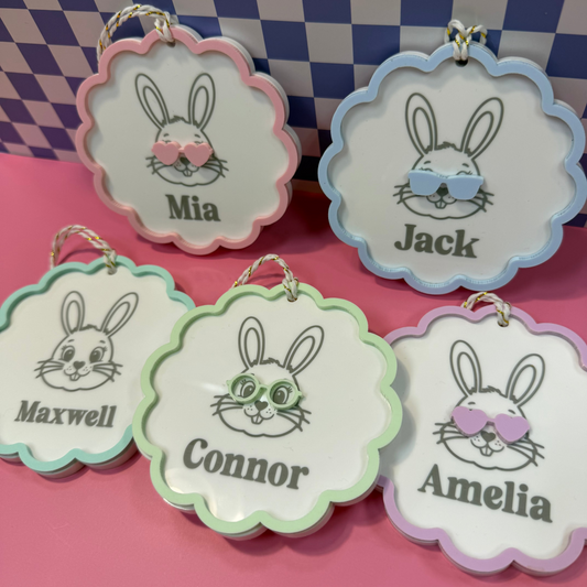 five easter basket tags with white backgrounds and bunny images along with pastel accents