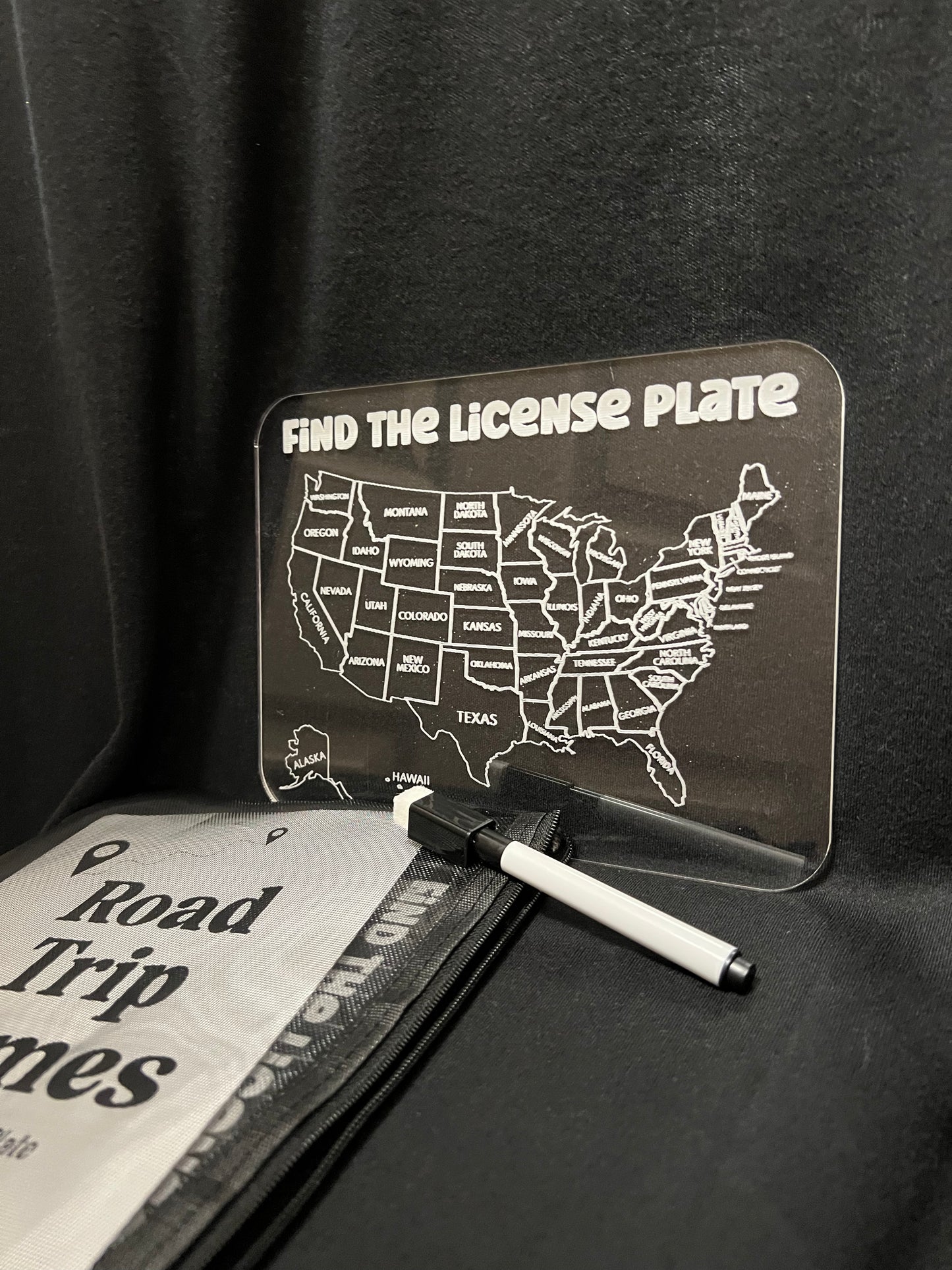 Find the license plate clear dry erase game with a marker with a black background