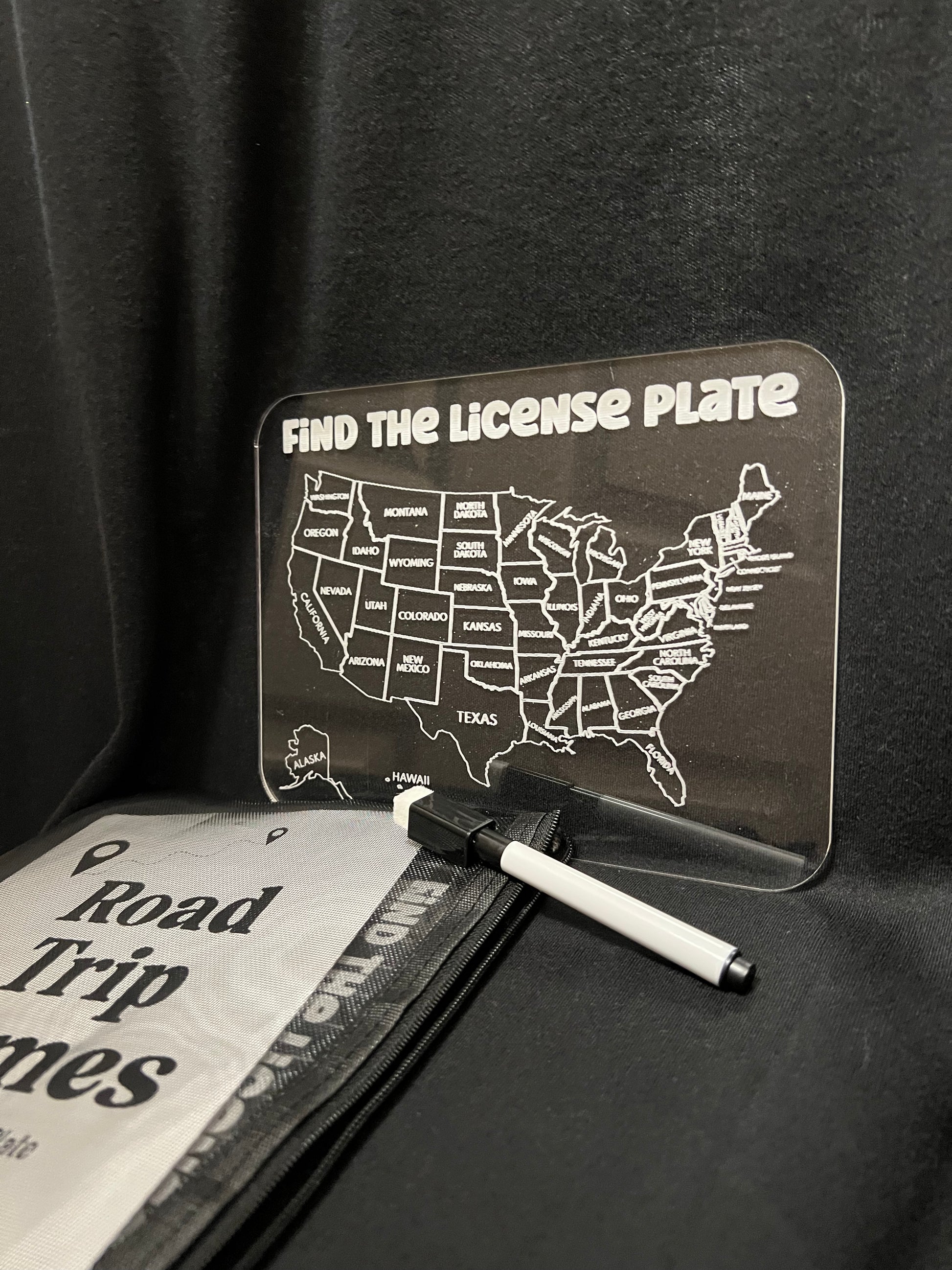 Find the license plate clear dry erase game with a marker with a black background
