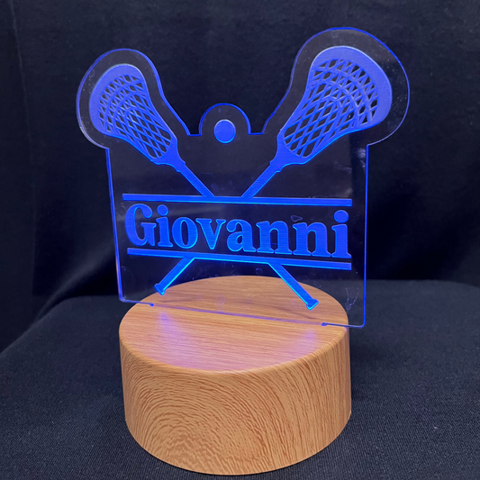 Lacrosse Name Night Light – Personalized LED night light featuring an engraved lacrosse stick and ball design with a custom name in the center, softly glowing for lacrosse players and fans.