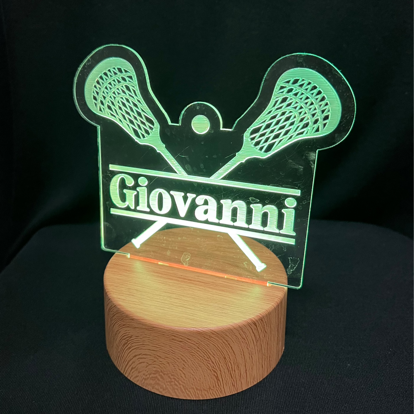 Lacrosse Name Night Light – Personalized LED night light featuring an engraved lacrosse stick and ball design with a custom name in the center, softly glowing for lacrosse players and fans.