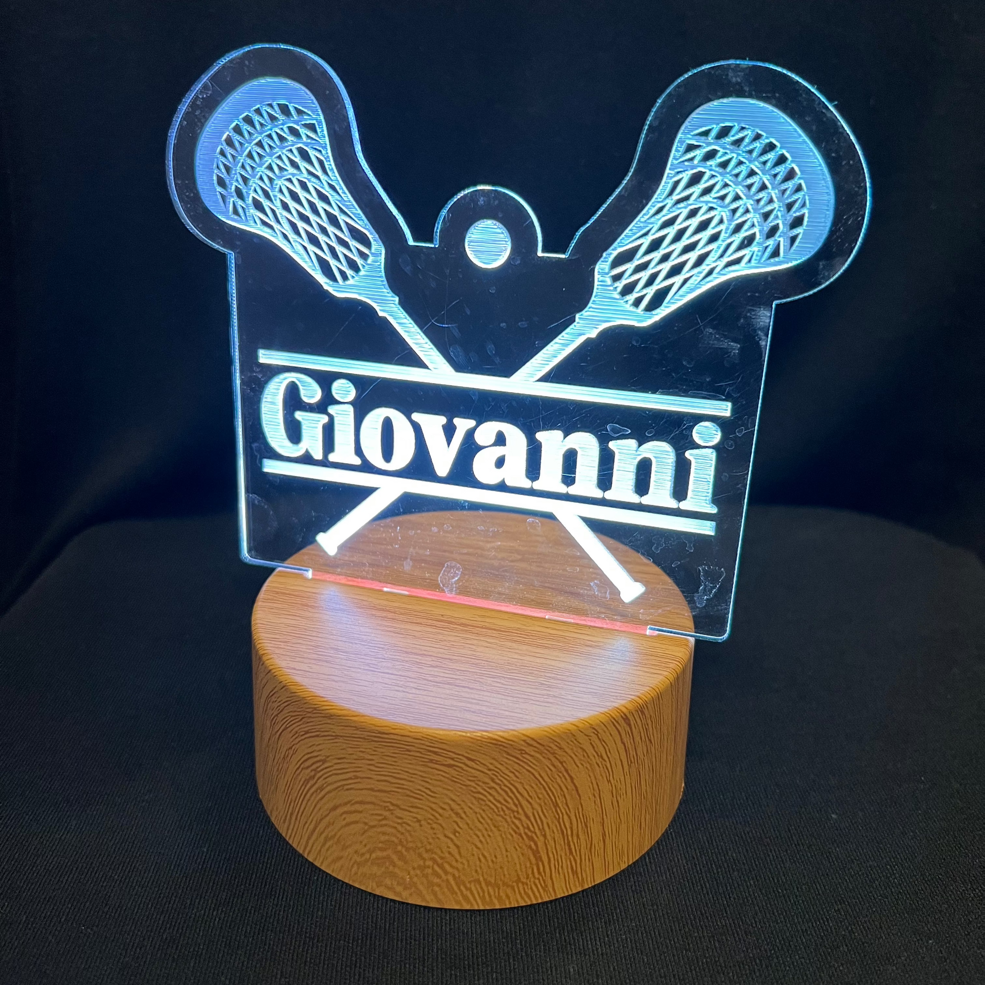 Lacrosse Name Night Light – Personalized LED night light featuring an engraved lacrosse stick and ball design with a custom name in the center, softly glowing for lacrosse players and fans.