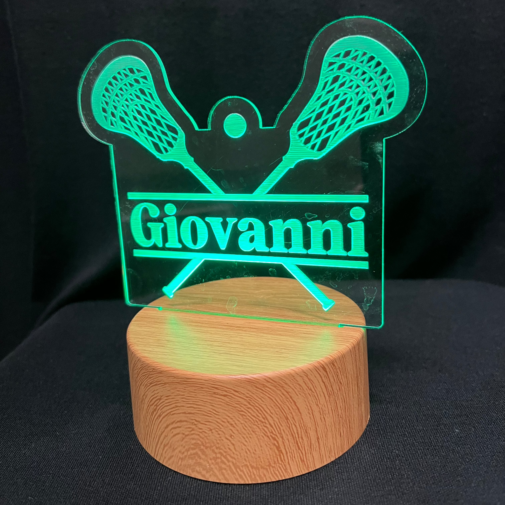 Lacrosse Name Night Light – Personalized LED night light featuring an engraved lacrosse stick and ball design with a custom name in the center, softly glowing for lacrosse players and fans.