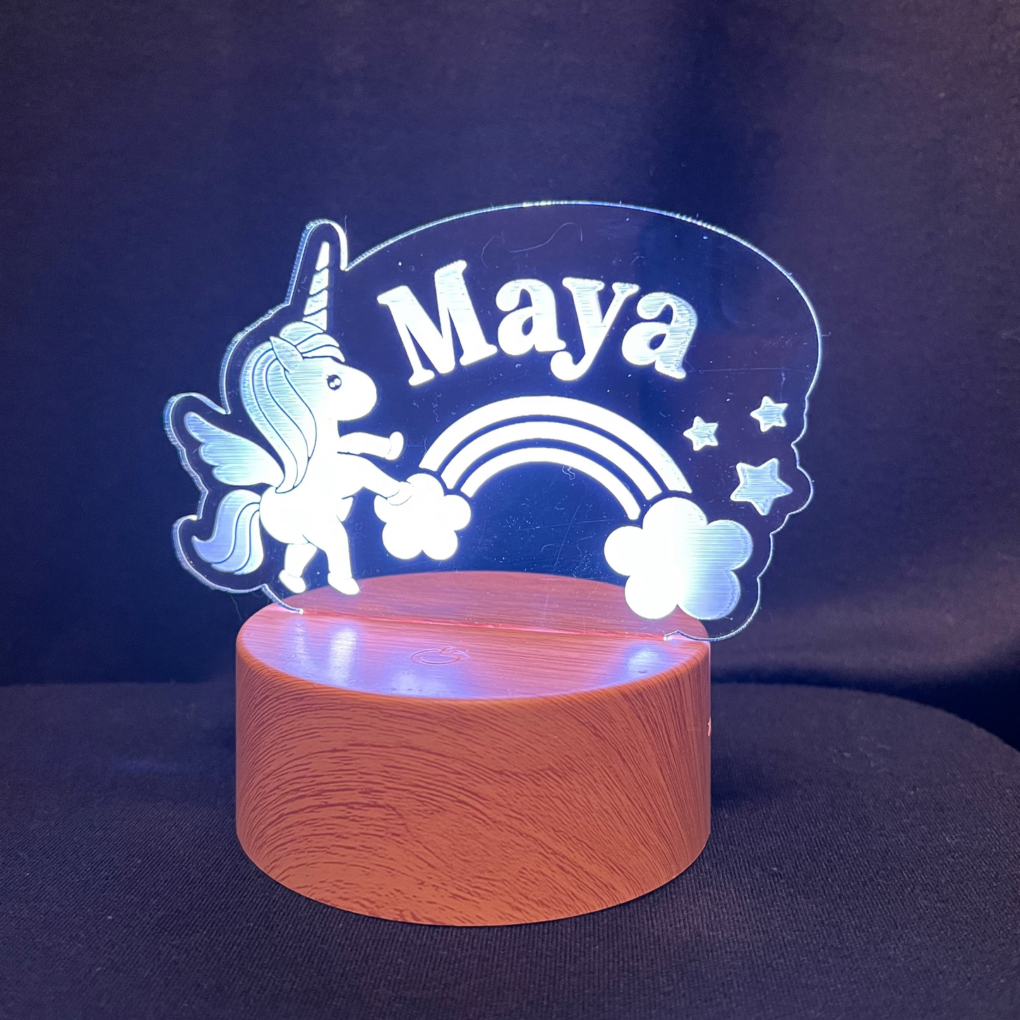 Decorative night light with unicorn and rainbow design, featuring the name 'Maya'.
