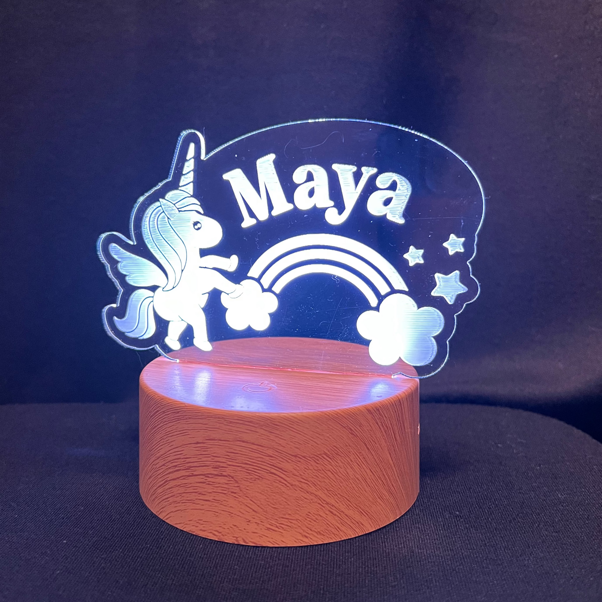 Decorative night light with unicorn and rainbow design, featuring the name 'Maya'.