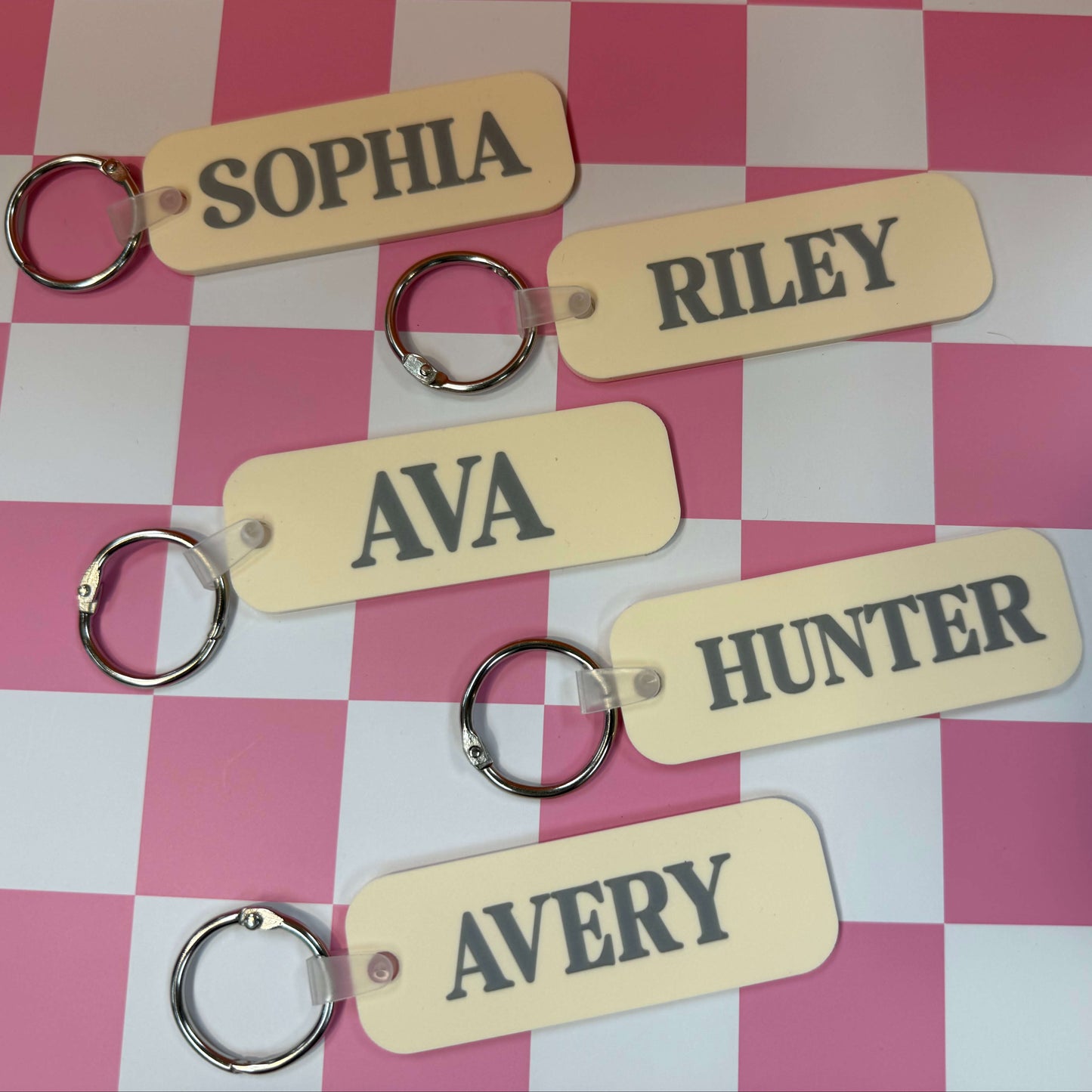 pastel peach bag tags on a checkered background