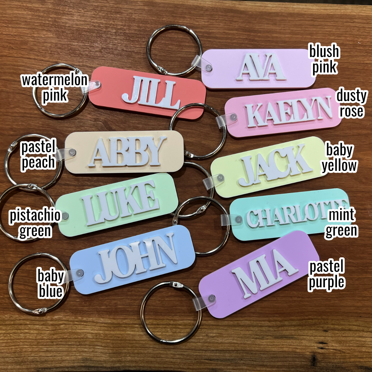 colorful bag tags with names on them and words to correspond with each color