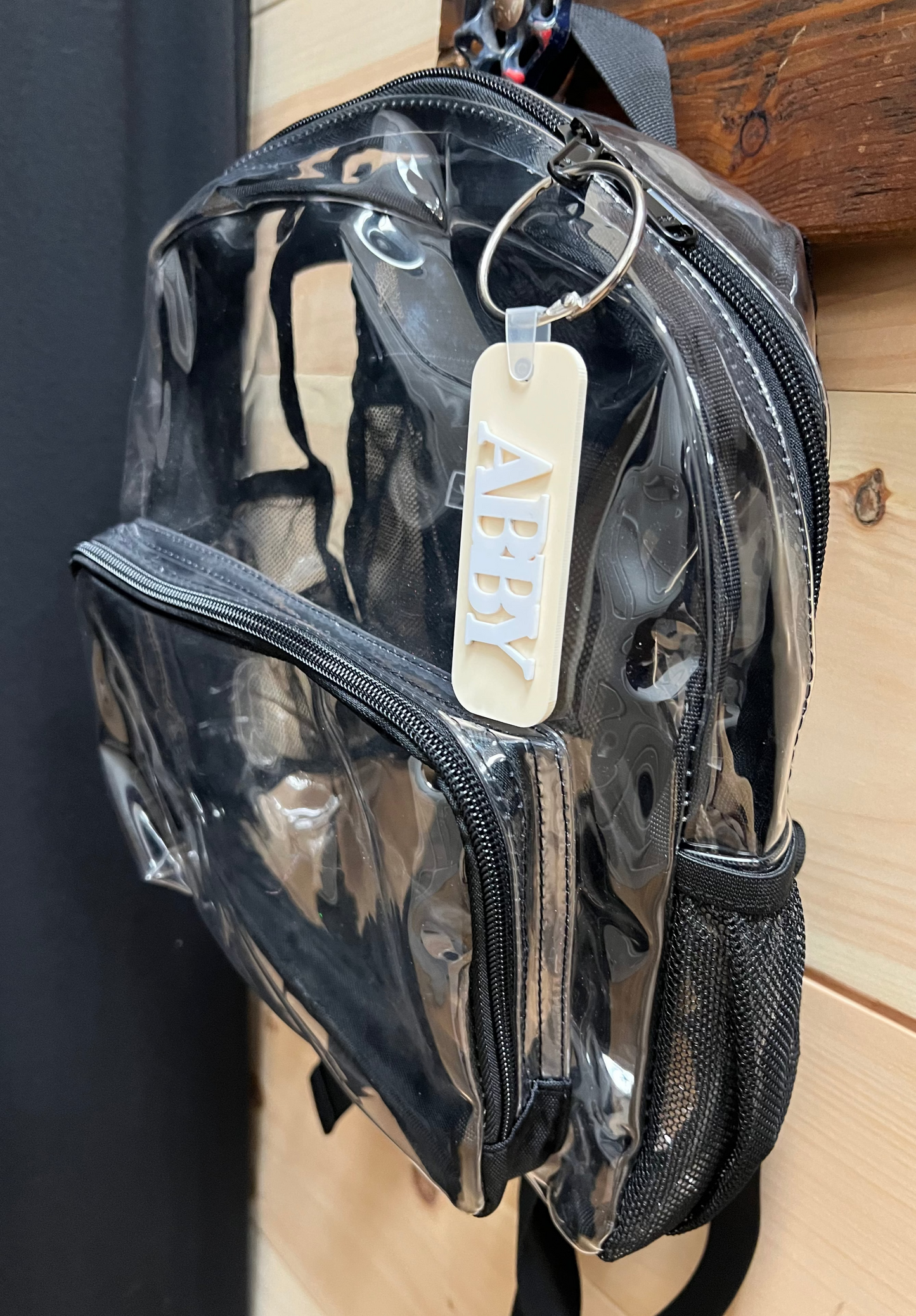 backpack with a pastel peach bag tag