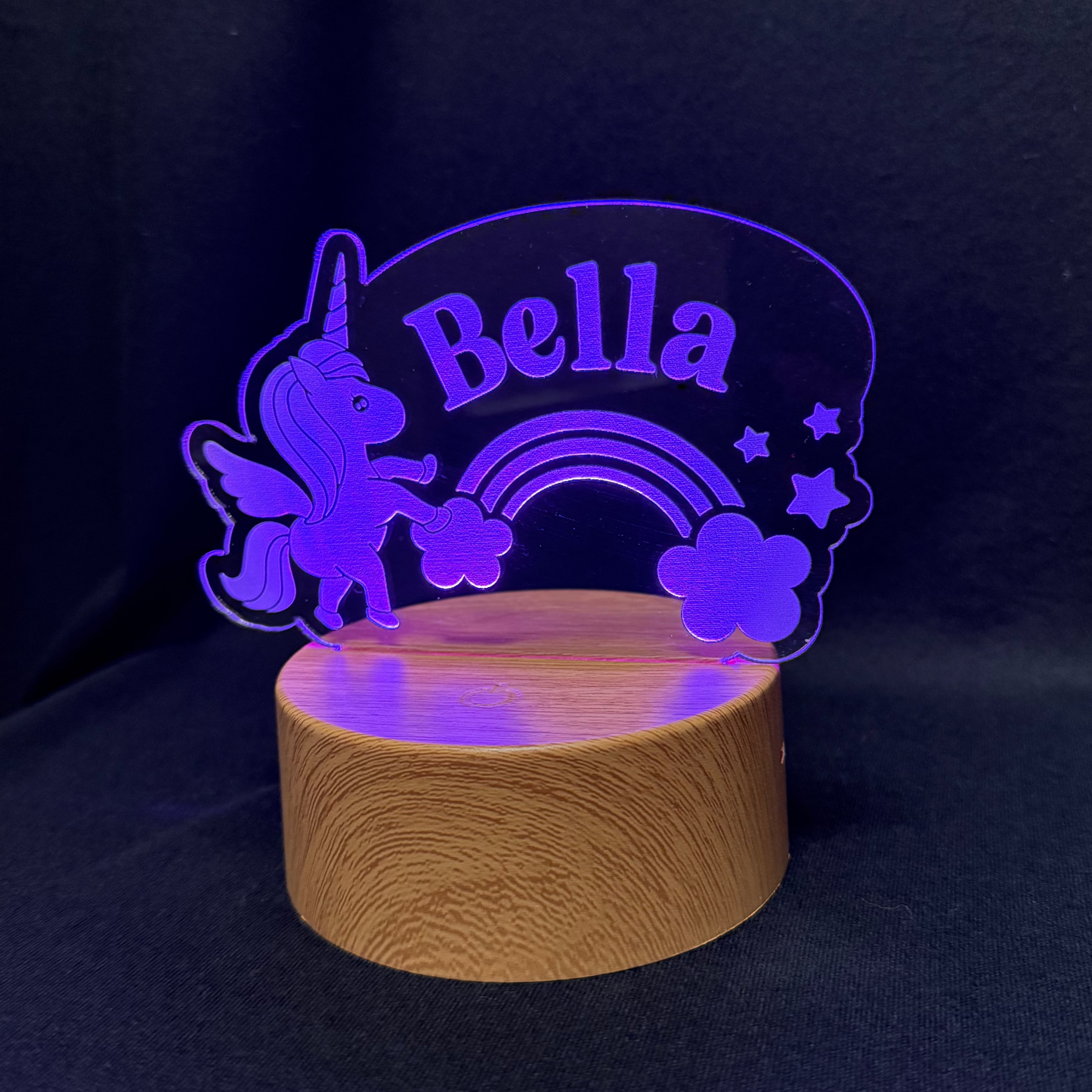 LED lamp with 'Bella' and unicorn design on a dark background
