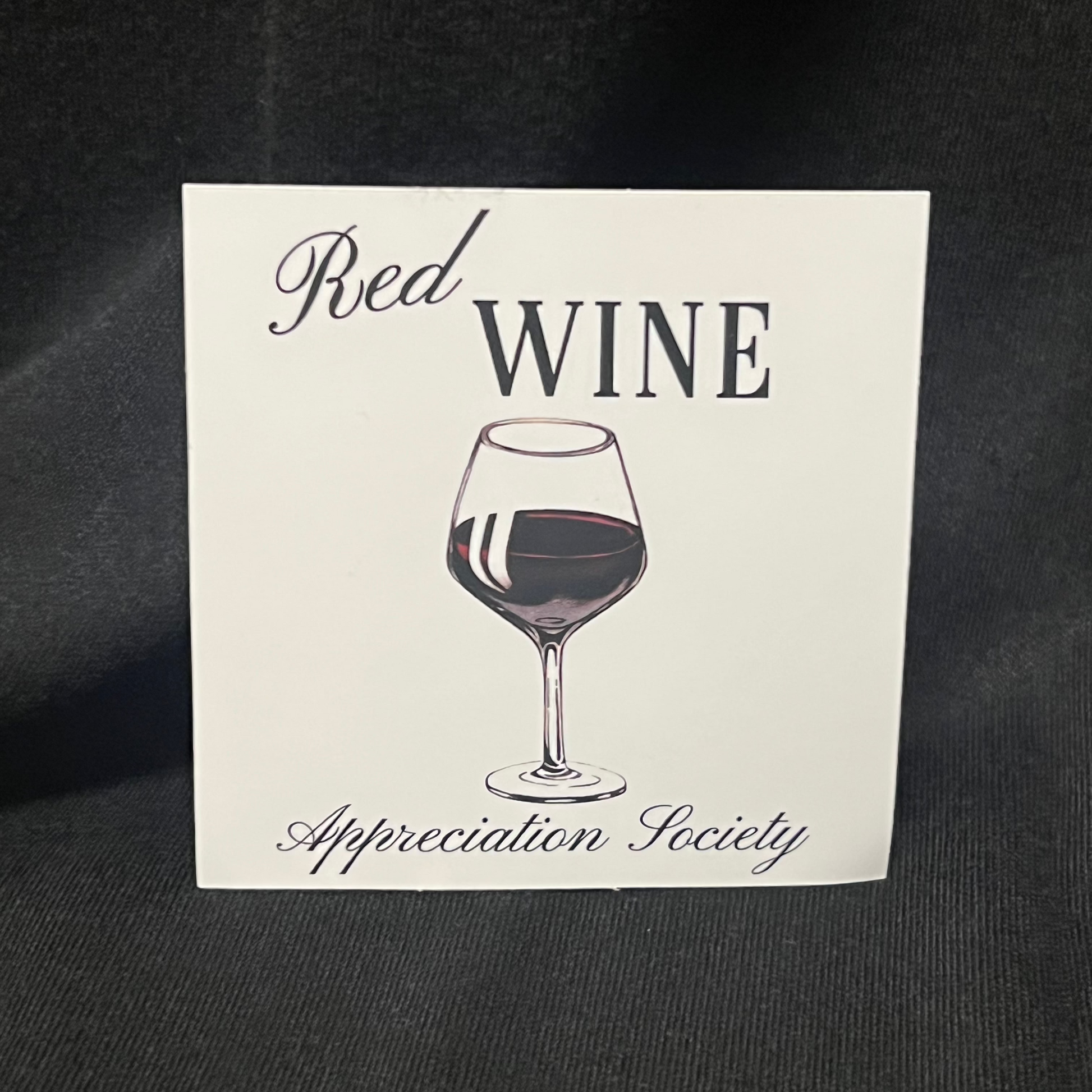 Sticker with the text 'Red Wine Appreciation Society' featuring an illustration of a red wine glass filled with deep red wine