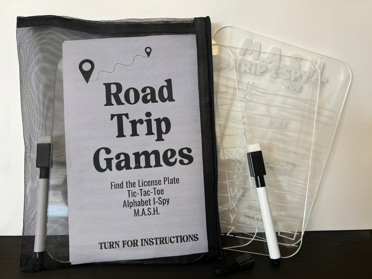 Road trip games set with a clear plastic cover and marker on a white background