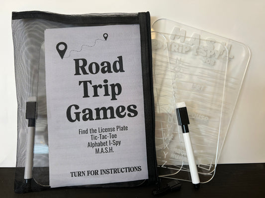 Road trip games set with a clear plastic cover and marker on a white background