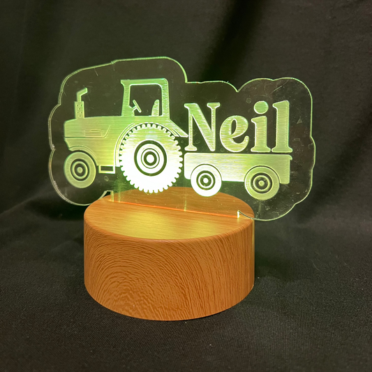 Custom LED night light featuring a tractor design and engraved name