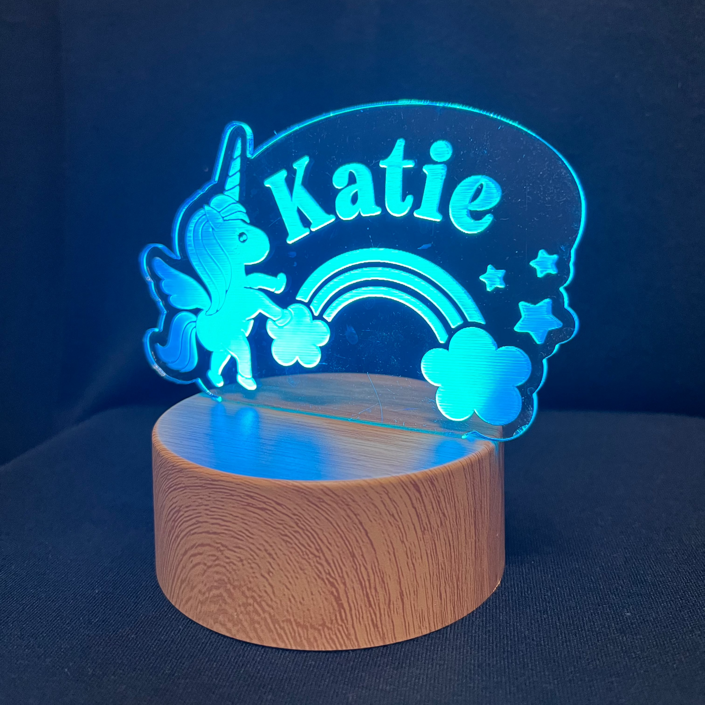Unicorn Name Night Light – Personalized LED night light featuring an engraved unicorn with a rainbow and stars, glowing softly around a custom name for a magical, dreamy touch